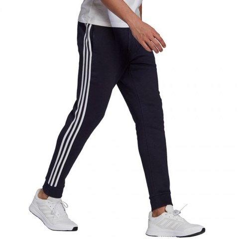 Spodnie adidas Essentials Fleece Tapered Cuff 3-Band M GK8823 Adidas